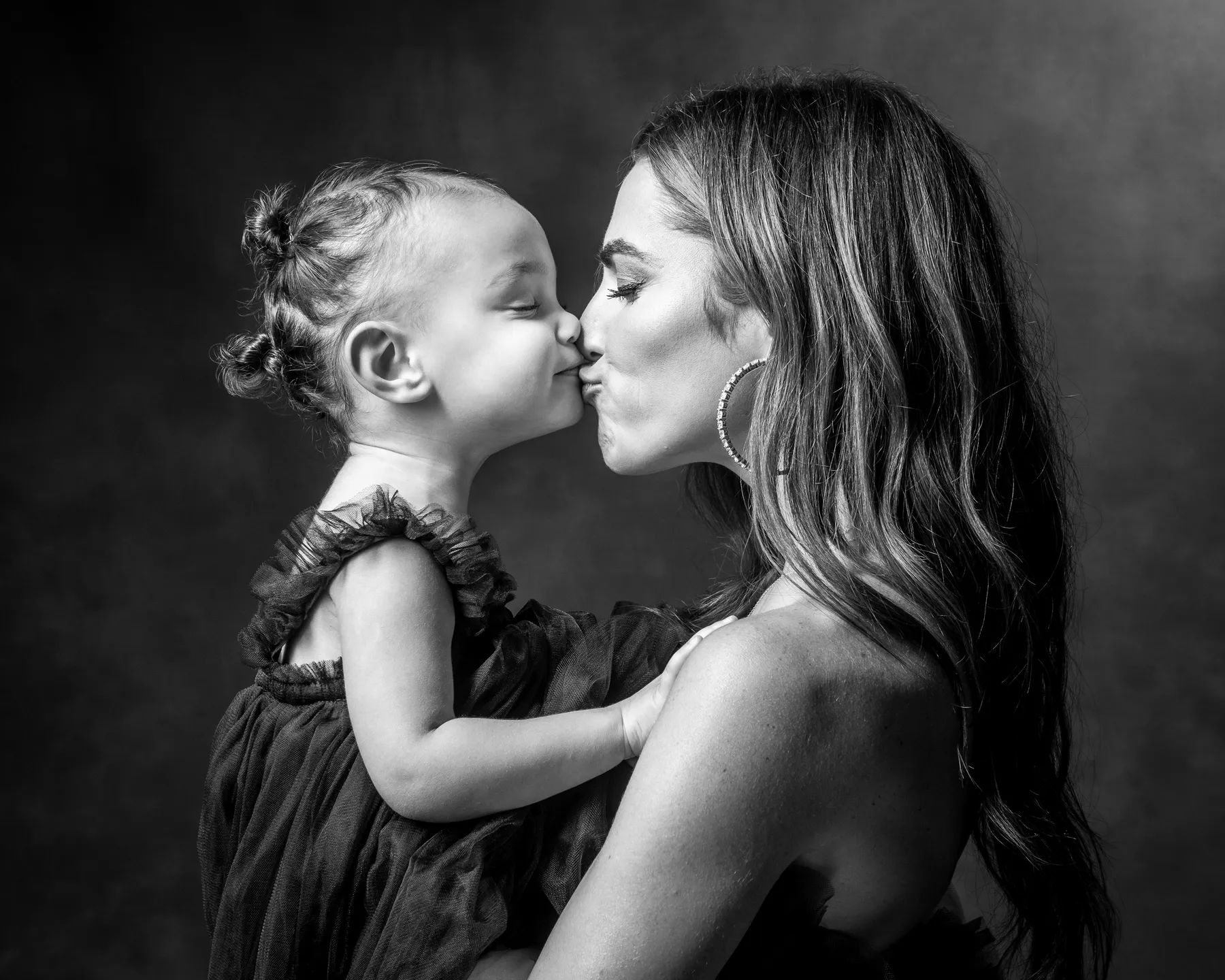Young mom kidding toddler daughter. Family and pet photographer Dallas.