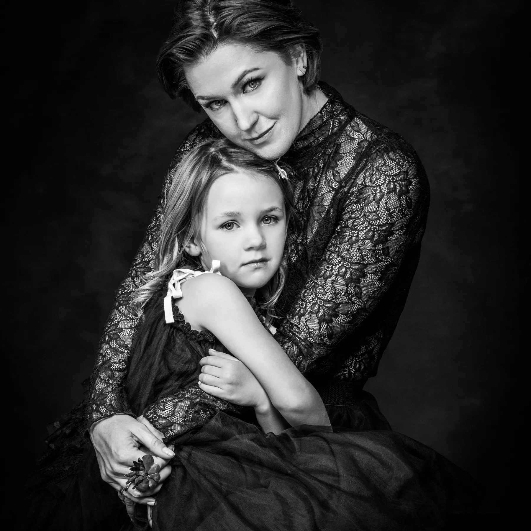 Mother and daughter wearing co-ordinating outfits for their family photo session at Richard Hill Studio Dallas