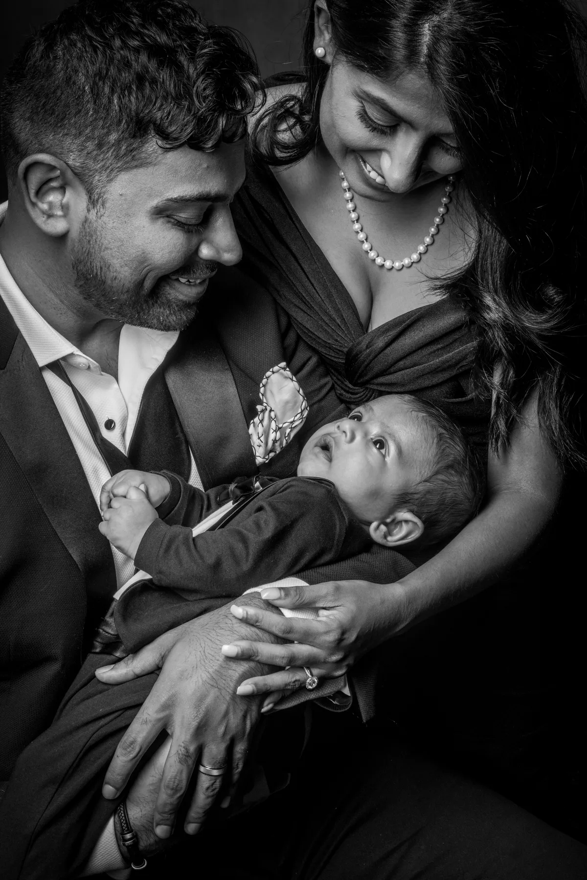 Young family with baby during their luxury family photography session at Richard Hill Studio