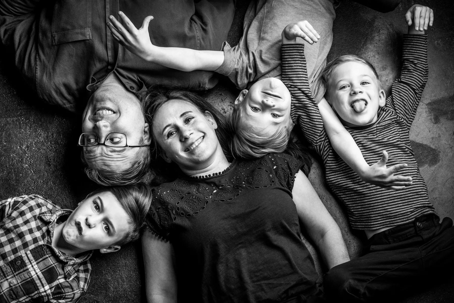 Parents and children laughing naturally during luxury family portrait session North Texas